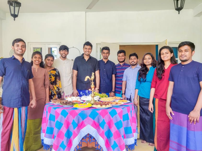 Konekt team gathered around the Avurudu table in 2019